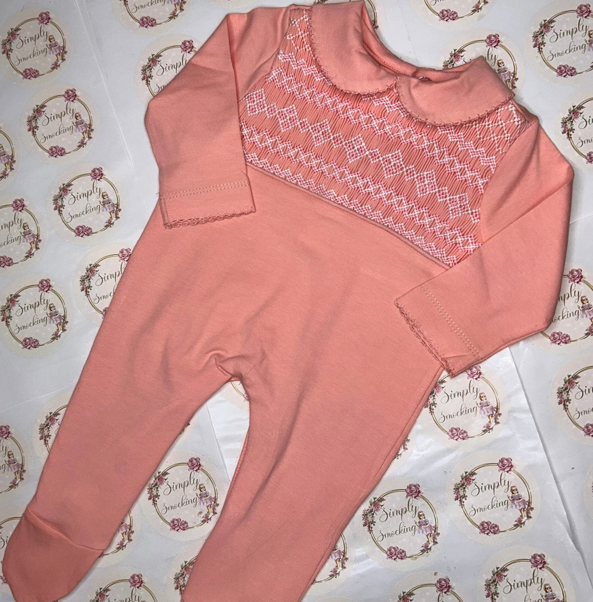 Peach Hand Smocked Babygrow