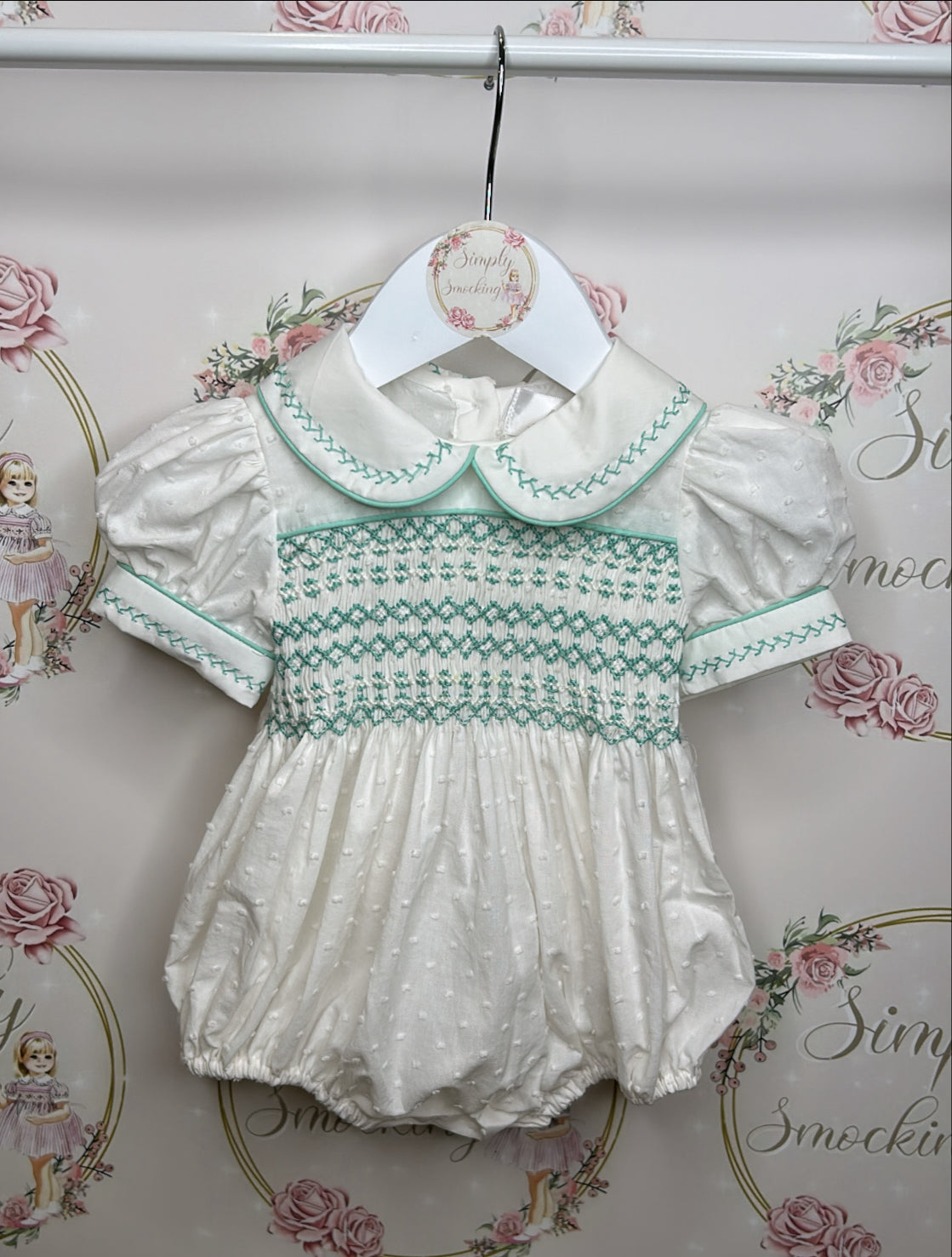 Hand smocked mint and white swiss dot romper